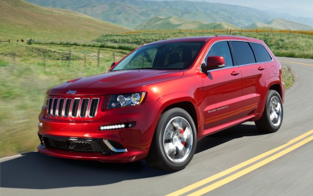 Red Red Jeep Grand Cherokee SRT-8 on road side view